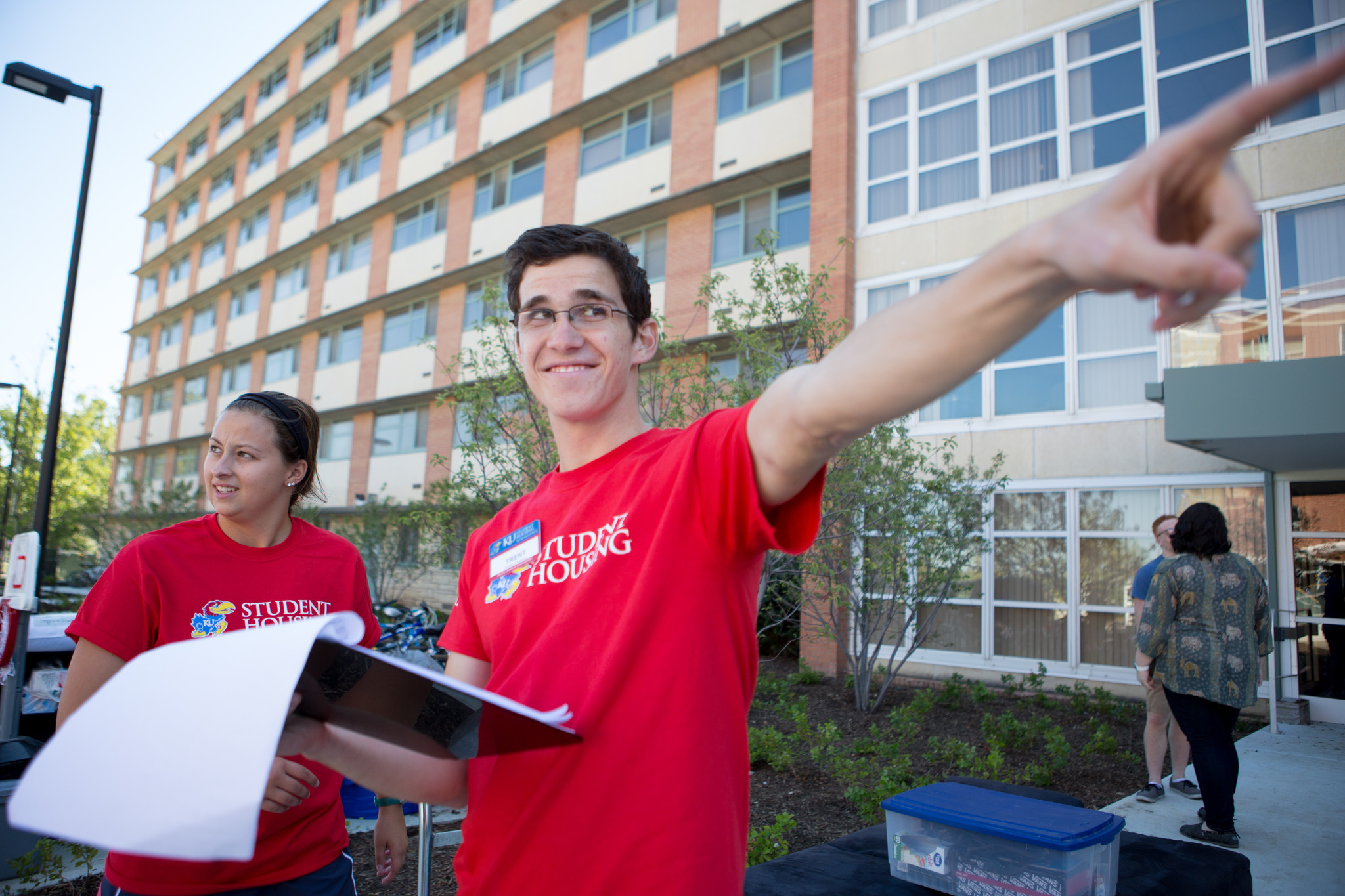 helpful student housing staff giving directions on move-in day