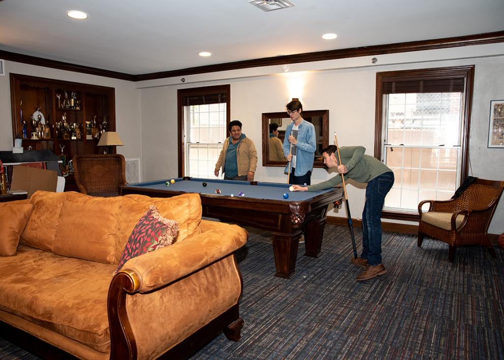 students playing a game of pool in Battenfeld living room