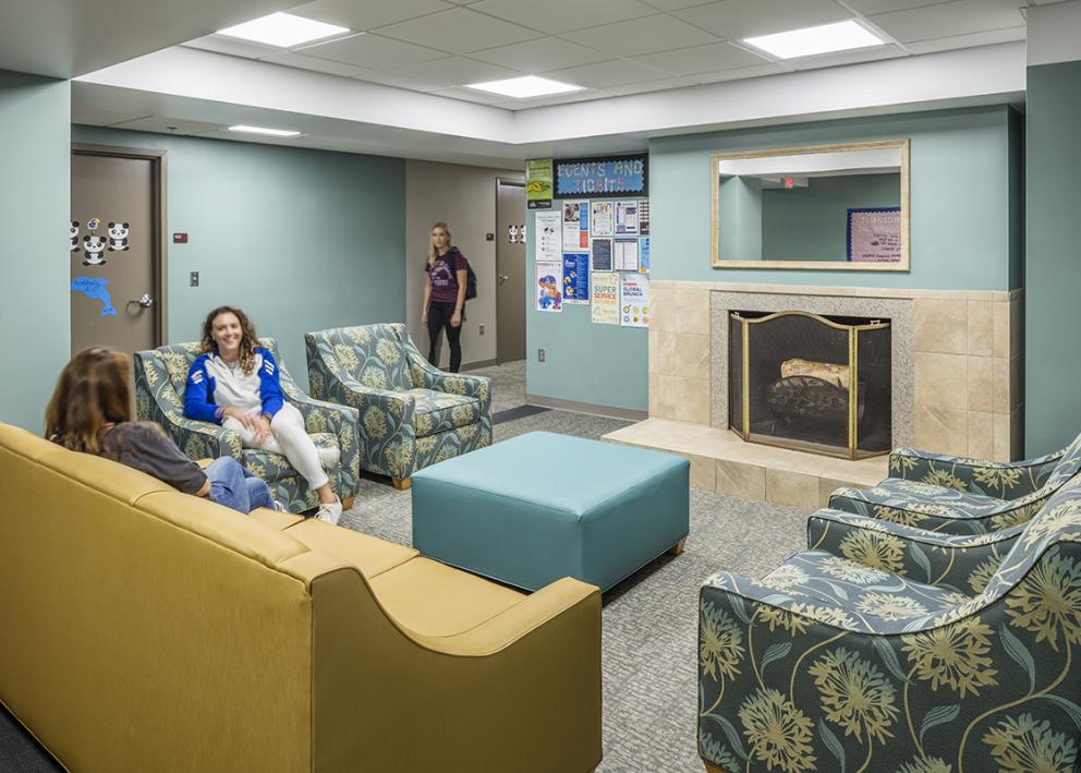 Newly renovated floor lobby with new carpet, paint and furniture.