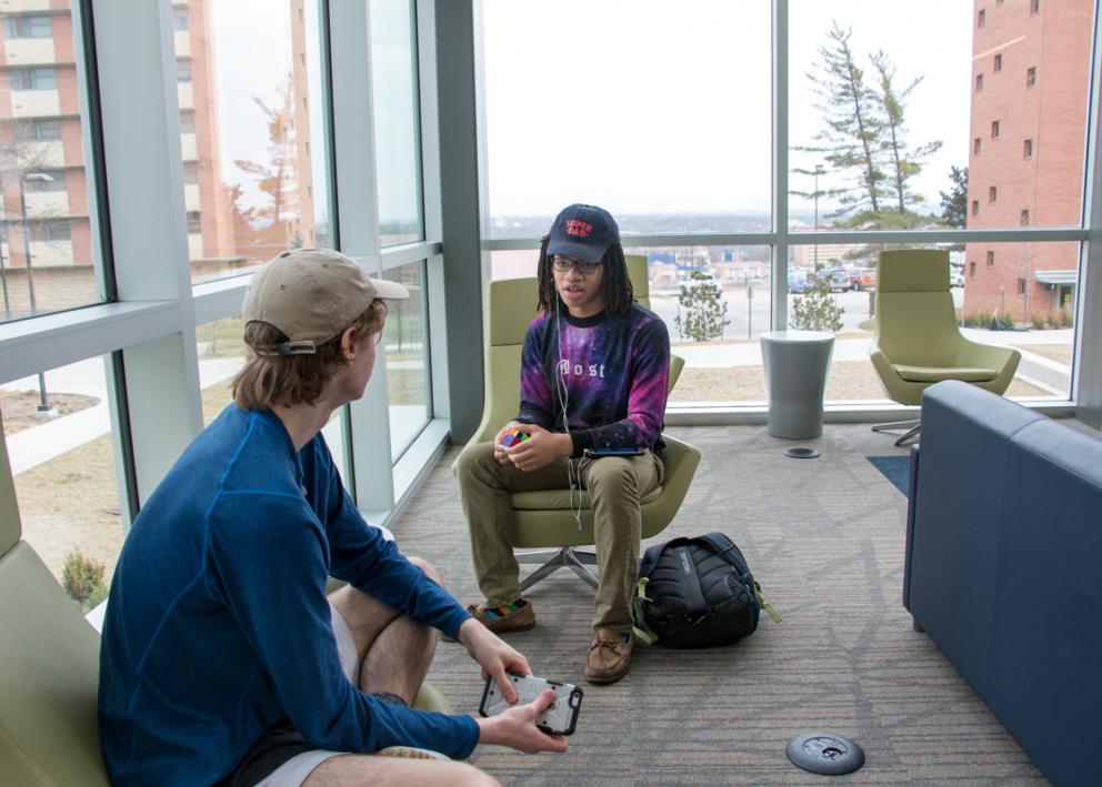 Students relax in Daisy Hill Commons living room