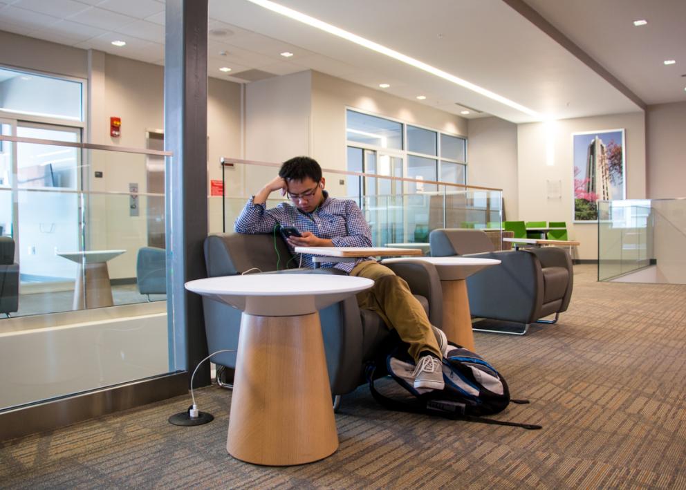 Student studying upstairs in Daisy Hill Commons