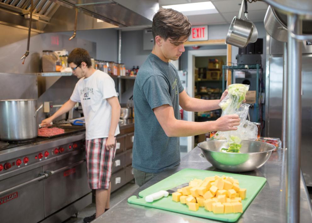 Students cooking in Stephenson Hall kitchen