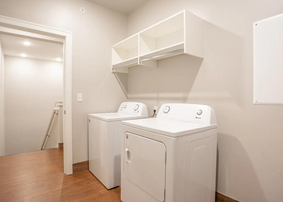 Image of Hawker Apartments in-room washer and dryer.