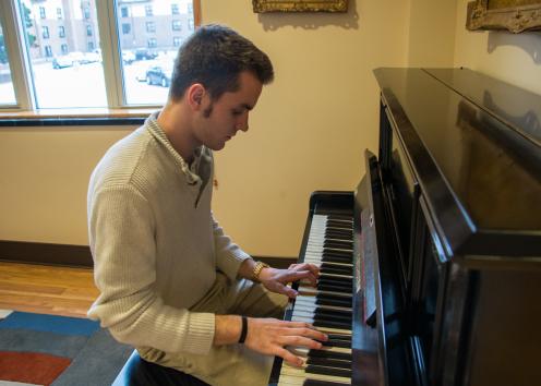 GSP residents plays hearth room piano.
