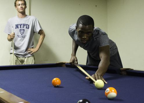 Students playing pool in the Stephenson TV room