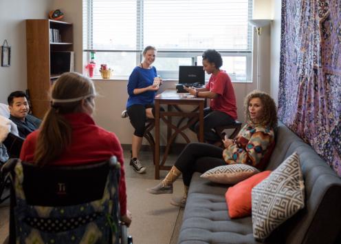 Students listen to vinyl in their suite living area