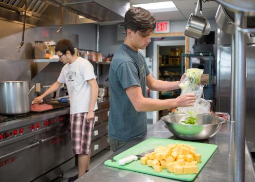 two Battenfeld residents cooking in the kitchen