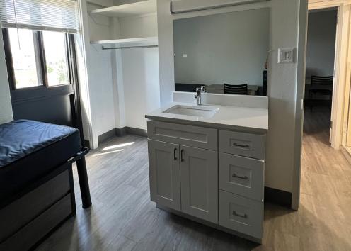 Image of a sink and bed in a Naismith 4-person split suite